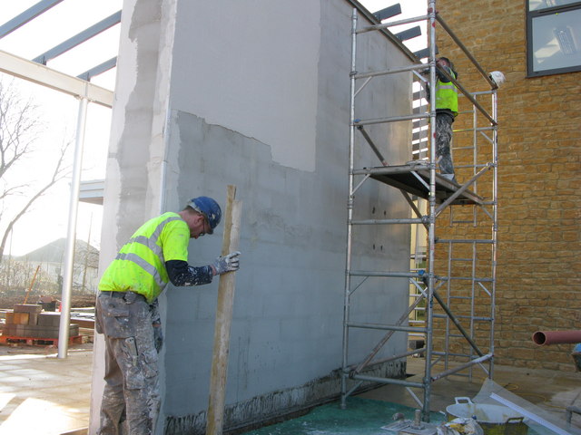Workers wearing hi-vis safety vests and hard hats