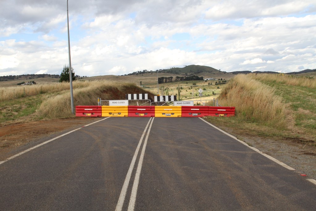 Road closed barricades across a roadway