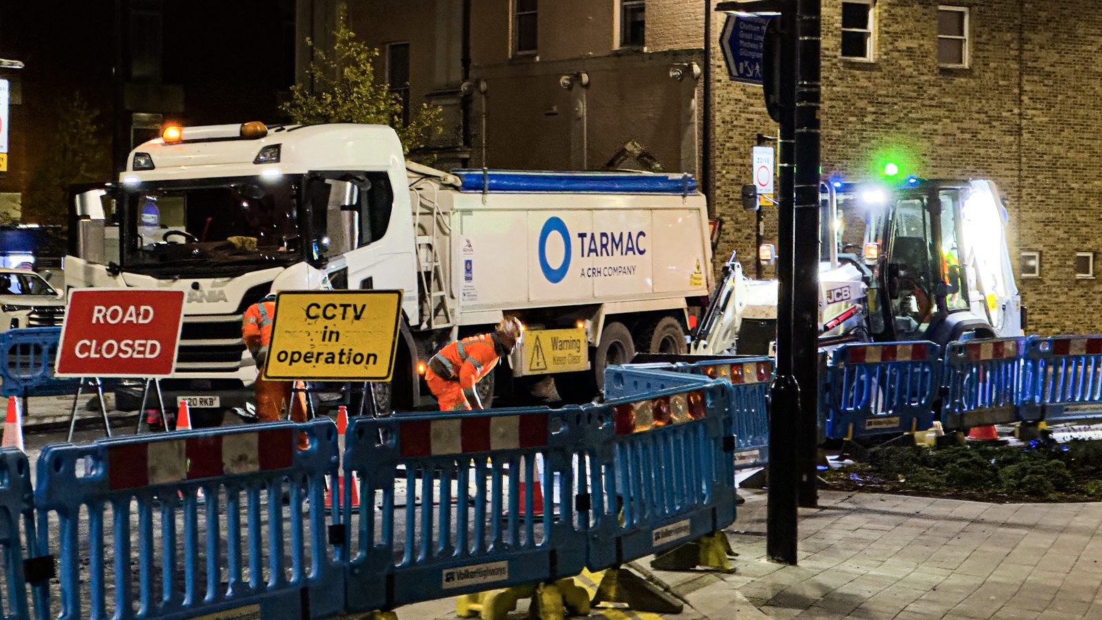 Plastic barrier fencing around night road works